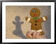 A Gingerbread Cookie Looks Scared While Being Held In A Boy's Hand by Joel Sartore Limited Edition Pricing Art Print