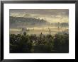 Aerial View Of A Farm At Twilight With Sunlight Streaking Through The Mist by Kenneth Garrett Limited Edition Print