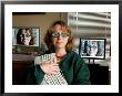 A Female Wears Circuit Glasses In Front Of Two Computer Monitors by Joel Sartore Limited Edition Print