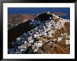 Whitewashed Houses On Hilltop Above Livadi Harbour, Hora, Greece by Mark Daffey Limited Edition Print