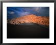 Couple Of Hikers Walking Through Shadows At Dusk, Valle De La Luna, Chile by Aaron Mccoy Limited Edition Print
