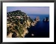 Rocky Coastline And Isola Faraglioni Offshore Rocks From Gardens Of Augustus, Capri, Italy by Pershouse Craig Limited Edition Pricing Art Print