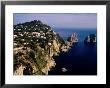 Rocky Coastline And Isola Faraglioni Offshore Rocks From Gardens Of Augustus, Capri, Italy by Pershouse Craig Limited Edition Print