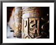 Detail Of Prayer Wheels With Tibetan Pali Script, Kagbeni, Nepal by Anthony Plummer Limited Edition Print