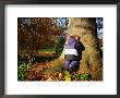 Boy Playing Hide-And-Seek In Frederiksberg, Copenhagen, Denmark by Martin Lladã³ Limited Edition Print