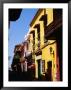 Colonial Facades In Street, Cartagena, Colombia by Wayne Walton Limited Edition Print