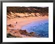 Figure Walking With Dog On Beach South Of Gnarabup Beach Near Margaret River, Australia by Trevor Creighton Limited Edition Print