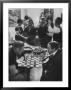 Men Playing Chess At A Cocktail Party by Francis Miller Limited Edition Pricing Art Print