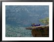 A Hiker Resting At A Cliffs Edge by Dugald Bremner Limited Edition Print
