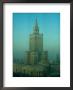 Palace Of Science And Culture In Haze, Warsaw, Poland by Krzysztof Dydynski Limited Edition Print