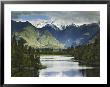 Cloud-Shrouded Mt. Cook Reflected In Lake Matheson, Near Town Of Fox Glacier, South Island by Dennis Flaherty Limited Edition Print