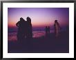 Muslim Women In Saris Watch A Spectacular Sunset From A Beach by Eightfish Limited Edition Pricing Art Print