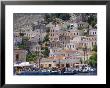 Moored Boats And Waterfront Buildings, Gialos, Symi (Simi), Dodecanese Islands, Greece by G Richardson Limited Edition Print