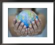 Woman's Hands Holding World Globe by Angelo Cavalli Limited Edition Print