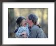 A Father And His Daughter Laugh Together While Wearing Coonskin Hats by Joel Sartore Limited Edition Print