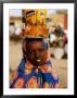 Girl In Colourful Wrap Balancing Paint Tin On Head, Agadez, Niger by Pershouse Craig Limited Edition Print