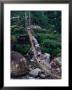 People Crossing Sagging Suspension Bridge Over Khudi Khola On Annapurna Circuit, Nepal by Tony Wheeler Limited Edition Pricing Art Print