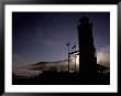 Sunrise On Foggy Otsego Lake Silhouettes A Lighthouse And Flags by Stephen St. John Limited Edition Print