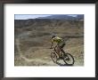 Back View Of Competitior Riding Downhill In Mount Sodom International Mountain Bike Race, Israel by Eitan Simanor Limited Edition Print