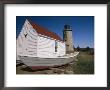 A Boat, Boathouse And Lighthouse On Monhegan Island by Clarita Berger Limited Edition Print