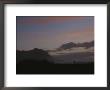 Sunset Over Coastline Of Tasman Sea With Lone Figure Of Hiker by Todd Gipstein Limited Edition Print