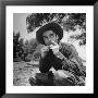 Actor Montgomery Clift Dressed In Cowboy Costume, Rolling Cigarette During Shooting Of Red River by J. R. Eyerman Limited Edition Print