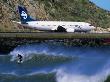Surfer In The Corner Next To Airport Runway, Lyall Bay, Wellington, New Zealand by Paul Kennedy Limited Edition Print