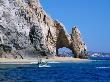 Tour Boat In The Water By El Arco, A Natural Arch At Land's End,Cabo San Lucas, Mexico by Lee Foster Limited Edition Print
