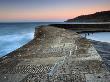 Dawn On Stone Walls Of Cobb, Lyme Regis, Dorset, England. Jurassic Coast World Heritage Site by Adam Burton Limited Edition Print