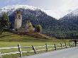 Man Passes A Church With A Forested, Snow-Capped Mountain Backdrop by Thomas J. Abercrombie Limited Edition Print