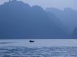 Fisherman In Silhouette At Dawn In Their Fishing Boat by Scott Stulberg Limited Edition Print