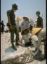 Identifying Remains Of Those Killed In Vietnam War Tet Offensive, Recently Found In Mass Grave by Larry Burrows Limited Edition Print