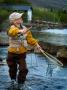 A Boy Holding A Fishing Rod And A Landing Net by Larus Karl Ingasson Limited Edition Print