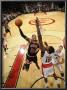 Chicago Bulls V Toronto Raptors: Taj Gibson And Amir Johnson by Ron Turenne Limited Edition Print