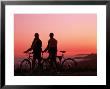 Silhouette Of Two Cyclists At Sunset by Paul Meyer Limited Edition Print