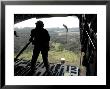 Airman Watches A Practice Bundle Fall From A C-17 Globemaster Iii by Stocktrek Images Limited Edition Print