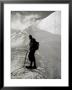 Portrait Of A Mountaineer With A Pick, Rope And Backpack On A Mountainous Peak Covered In Snow by A. Villani Limited Edition Print