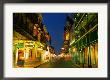 Flags Hanging Over The Empty Bourbon Street At Night, New Orleans, Louisiana, U.S.A. by Richard Cummins Limited Edition Print