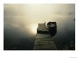 The Morning Sun Shines On A Rowboat Tied To A Dock by Stephen Alvarez Limited Edition Print