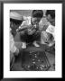 Boys Playing Board Game On Sidewalk In Front Of The Trocadero Hotel by Dmitri Kessel Limited Edition Print