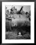 Oncoming View Of Tank About To Pass Over Foxhole In Which A Soldier Is Crouched Down by Myron Davis Limited Edition Pricing Art Print