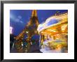 Eiffel Tower In Twilight Fog And Rain, Merry-Go-Round In Foreground, Paris, France by Jim Zuckerman Limited Edition Print