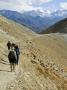 Hikers On A Trail Near Lo Monthang On The North Side Of The Himalayas by Stephen Sharnoff Limited Edition Pricing Art Print