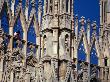 Tourists Standing Among Spires Of Milan Cathedral, Milan, Italy by Jon Davison Limited Edition Print