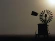 Windmill And Water Tank On Misty Morning At Sunrise, Victoria, Australia by Bernard Napthine Limited Edition Print