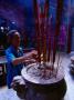 Man Making Incense Offerings In Temple, Vietnam by Mason Florence Limited Edition Print