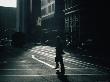 Man Crossing Street With Cable Car Looming In Background, San Francisco, California, Usa by Curtis Martin Limited Edition Print