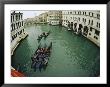 Gondolas Travel Down A Canal In Venice by Raul Touzon Limited Edition Print