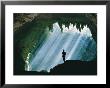 A Man Stands Below The Mouth Of A Giant Cave by David Boyer Limited Edition Pricing Art Print