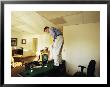 A Man Plays Golf On His Desk by Joel Sartore Limited Edition Print